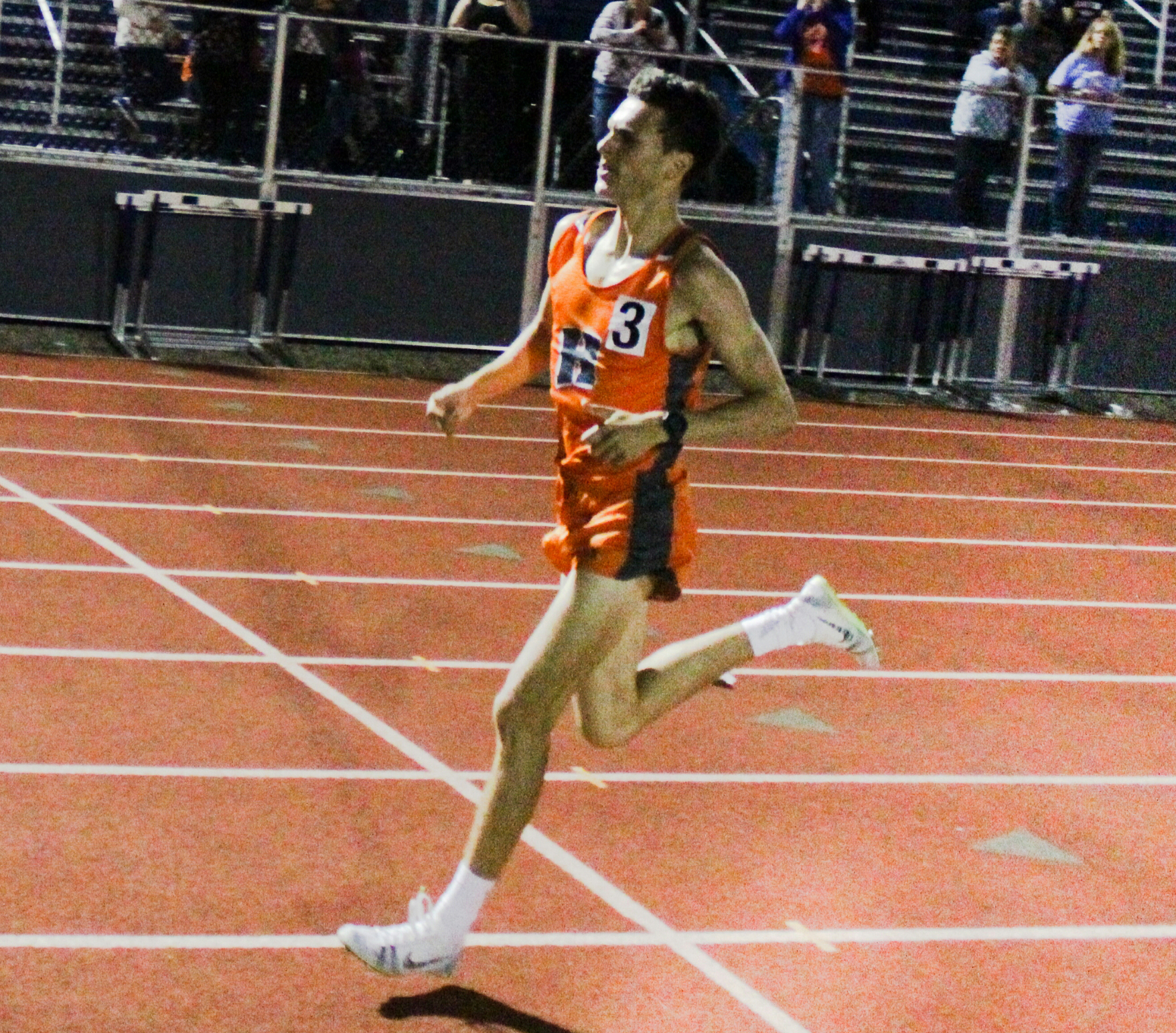 Josh Plischke racing in high school track